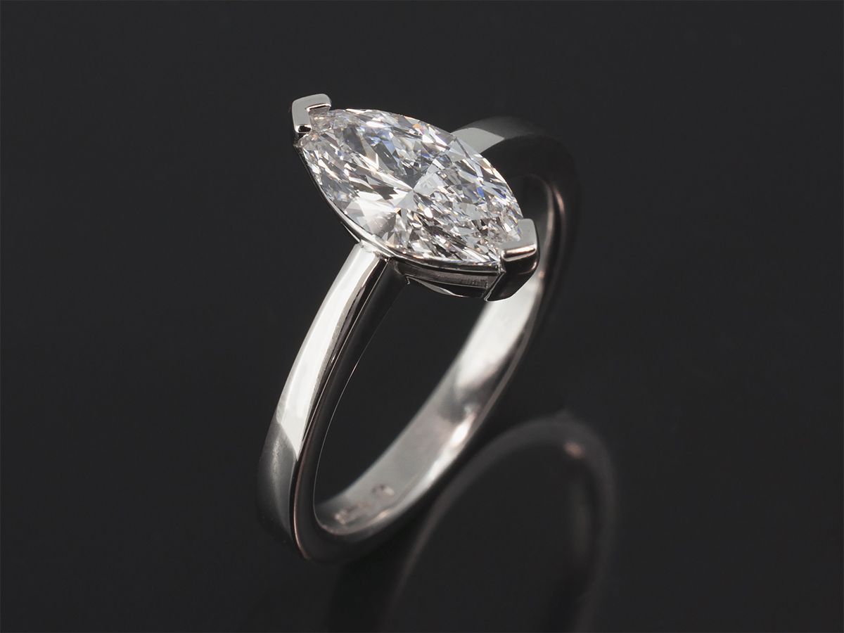 A platinum claw-set marquise-cut diamond solitaire ring made by Blair and Sheridan, Glasgow